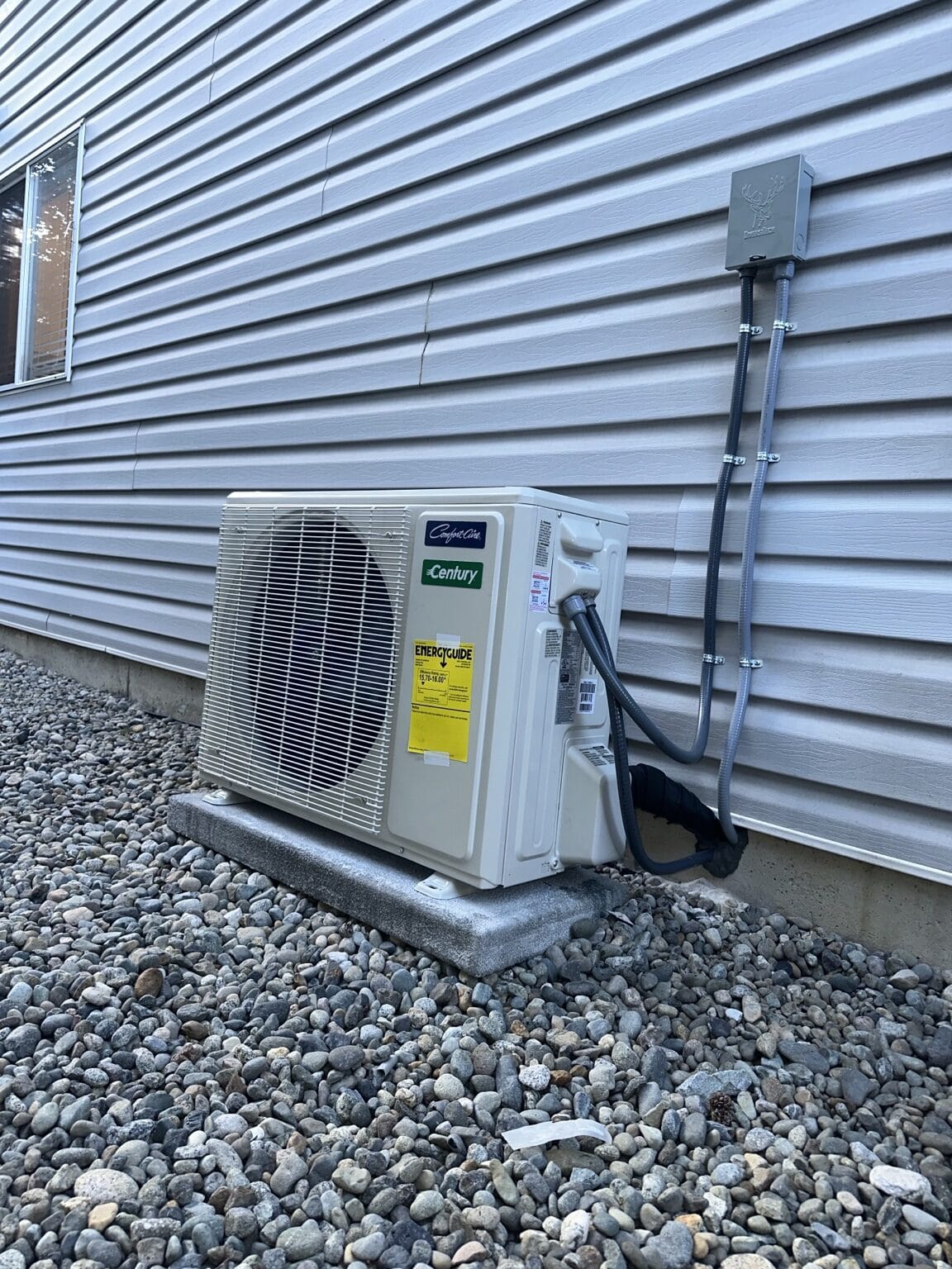 Completed Carrier central heat pump installation with service access