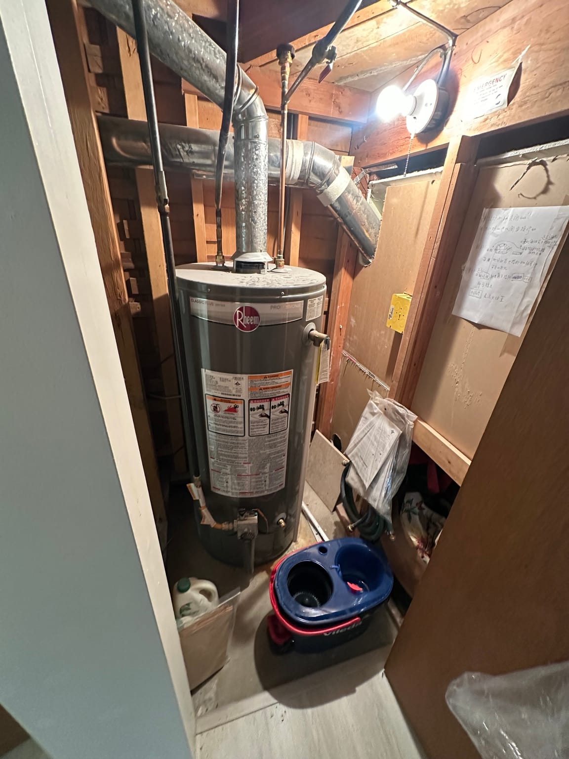 Old Rheem gas hot water tank before replacement in a Metro Vancouver home