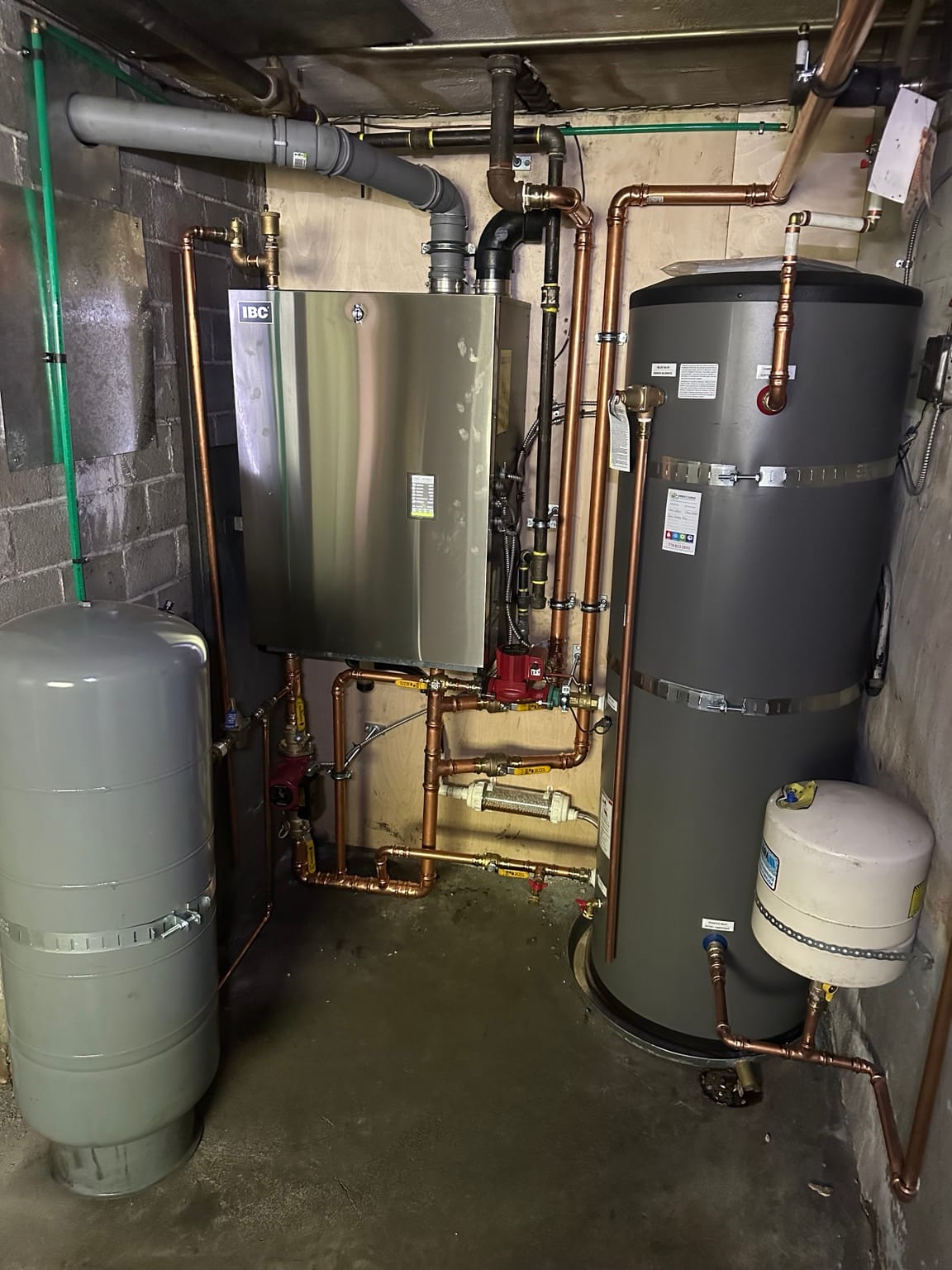 Boiler and hot water tank installation with hydronic piping by Perfect Choice Heating and Cooling