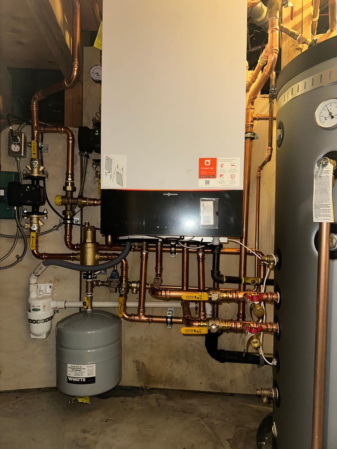 Wall-hung Viessmann condensing boiler with hydronic piping installed by Perfect Choice Heating and Cooling