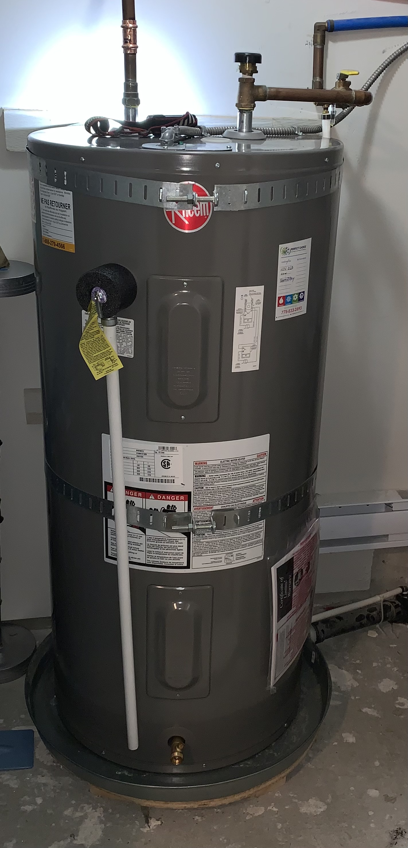 Rheem electric hot-water tank installed with seismic restraint straps by Perfect Choice HVAC