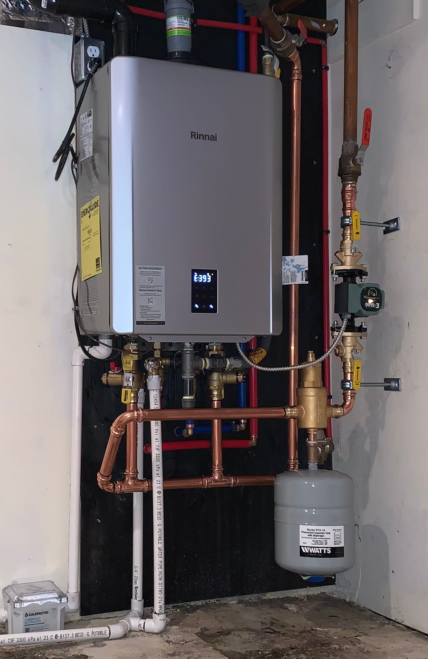 Rinnai high-efficiency combi boiler with organized hydronic piping installed by Perfect Choice HVAC