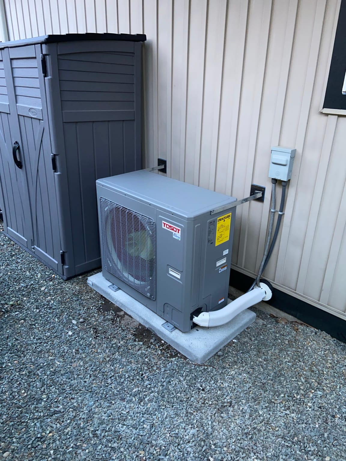 TOSOT cold-climate inverter heat pump installed on a level equipment pad by Perfect Choice HVAC
