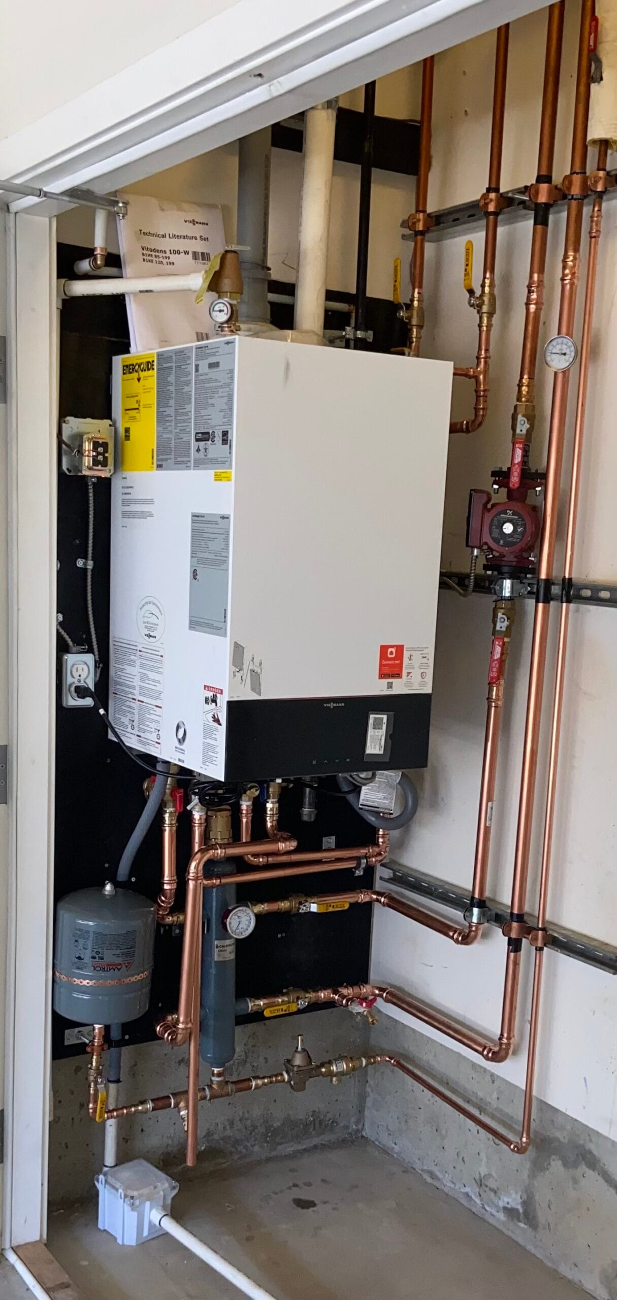 Viessmann Vitodens 100-W condensing boiler with organized copper piping after installation
