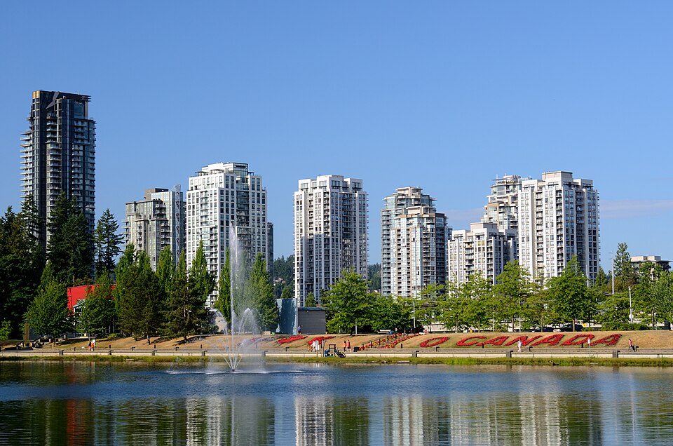 Coquitlam skyline and fountain at Lafarge Lake in Town Centre Park